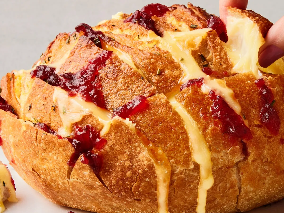 Serving inspiration: a round pull-apart bread filled with brie and cranberry sauce.